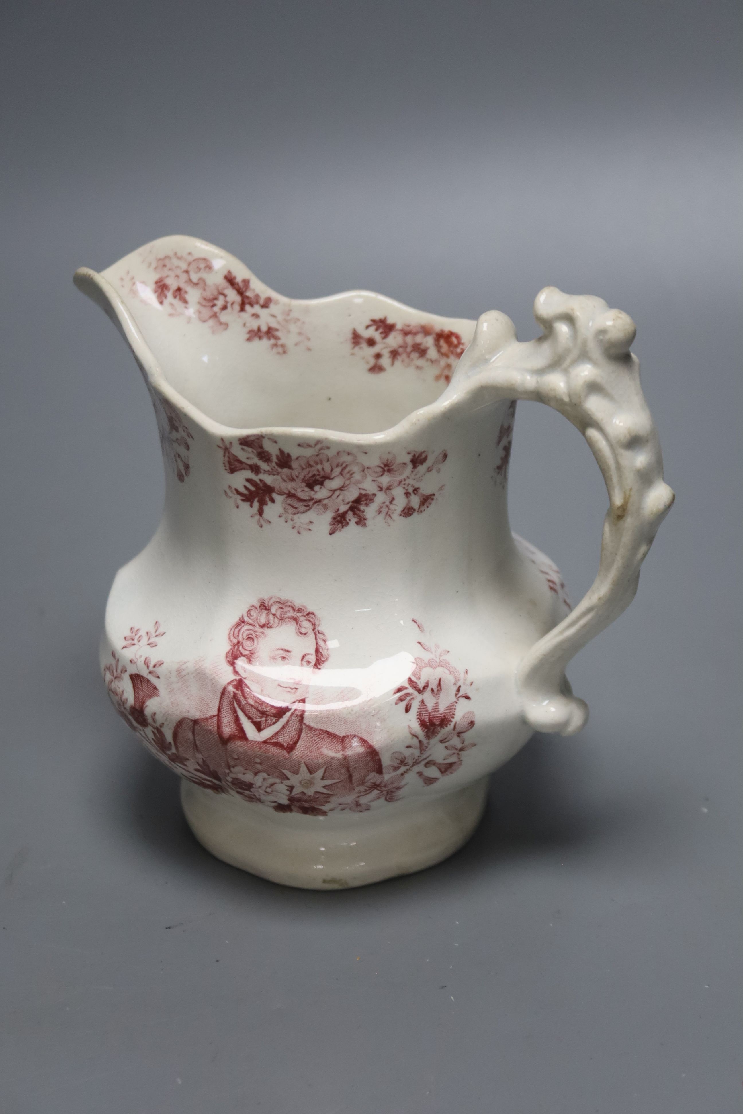 A George IV commemorative pottery jug, 14cm tall